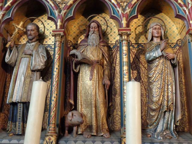 Een detail uit het hoofdaltaar met in het midden de patroon van de kerk. © Hilde Van den Bossche